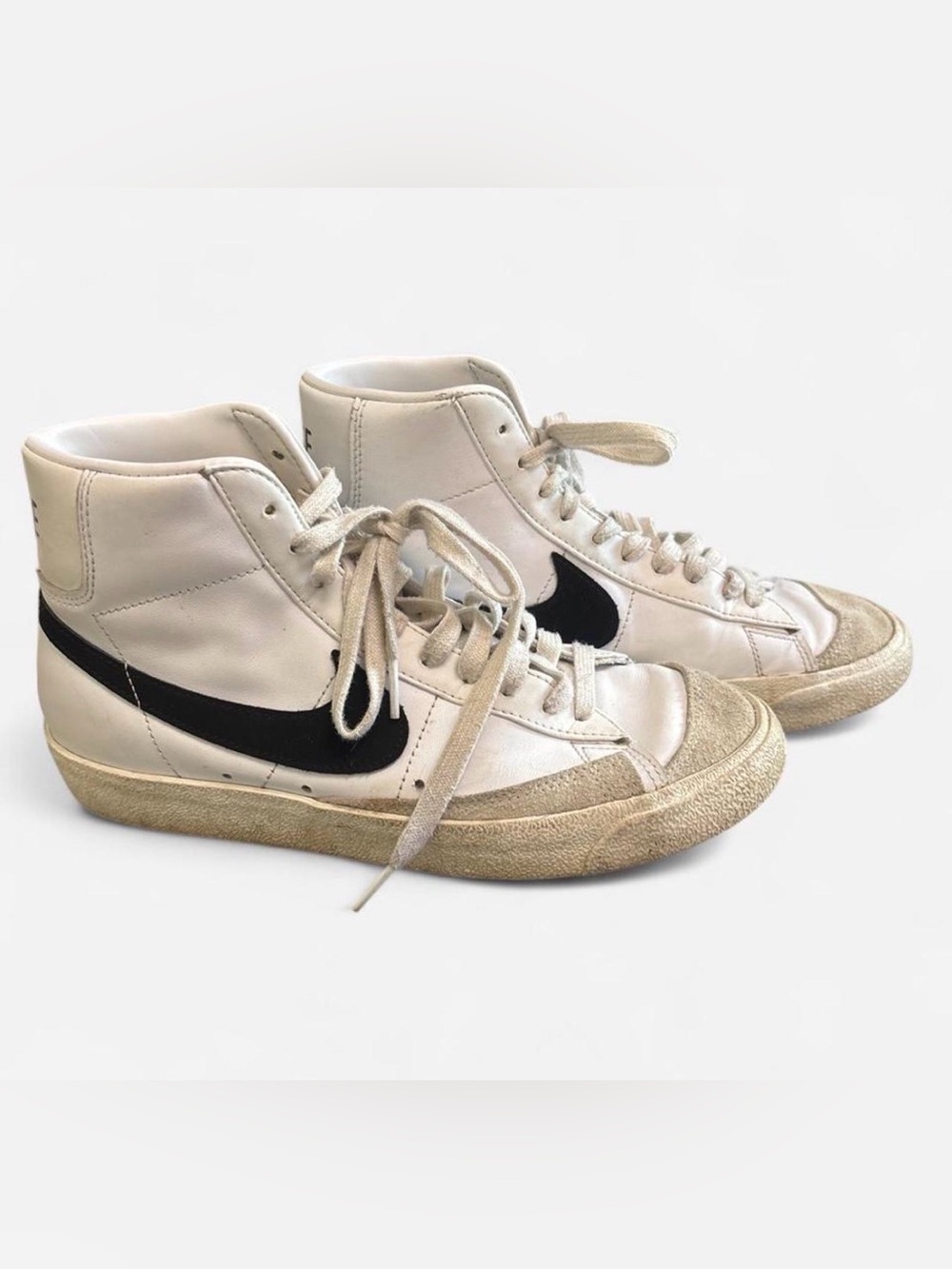 Nike White High-Top Sneakers with Black Swoosh